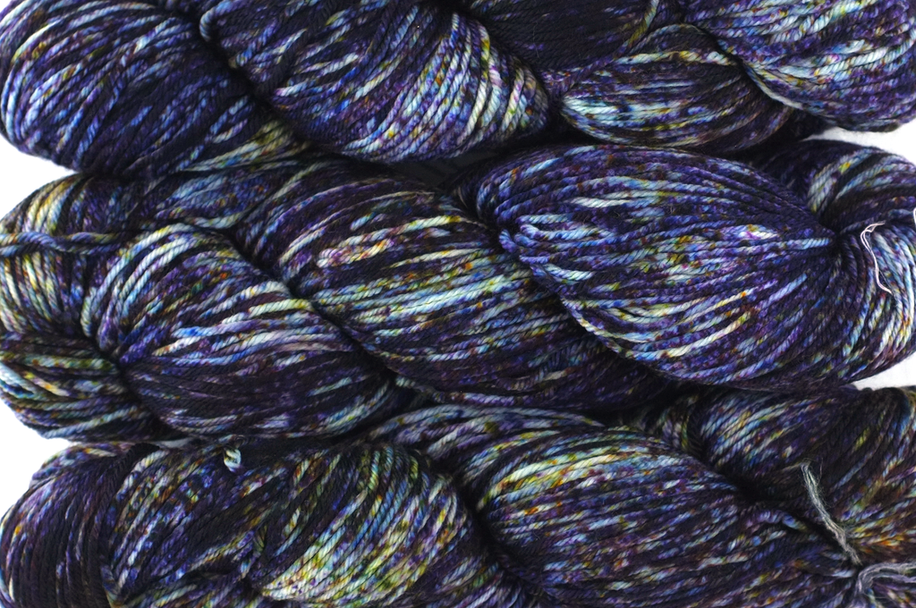 Malabrigo Arroyo in color Camino, Sport Weight Merino Wool Knitting Yarn, speckle dyed deep violet, yellow, #163