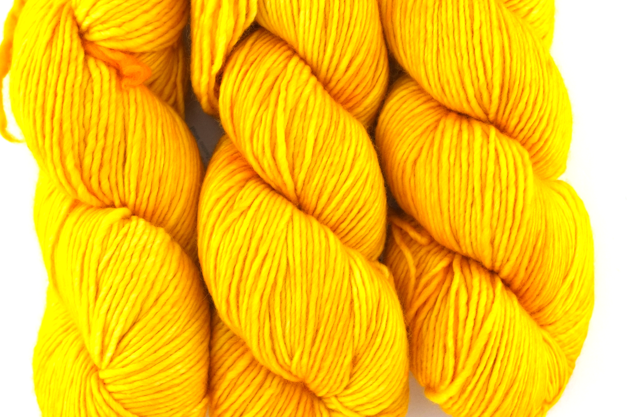 Malabrigo Worsted in color Sauterne, Merino Wool Aran Weight Knitting Yarn, warm buttercup yellow, #022