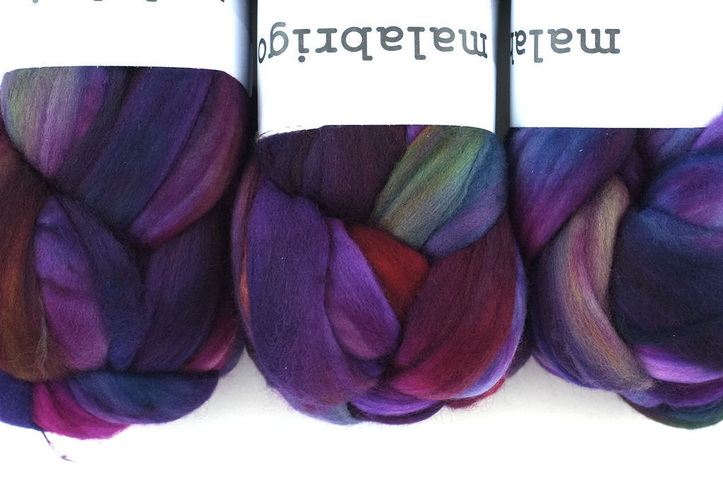 Malabrigo Nube, Boreal, dark rainbow, magenta, navy, color 884, merino spinning fiber from Purple Sage Yarns