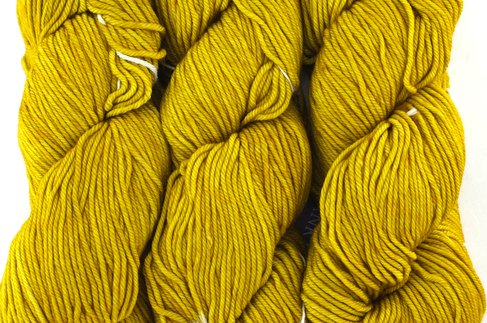 Malabrigo Rios in color Frank Ochre, Worsted Weight Superwash Merino Wool Knitting Yarn, rich ochre yellow, #035 from Purple Sage Yarns