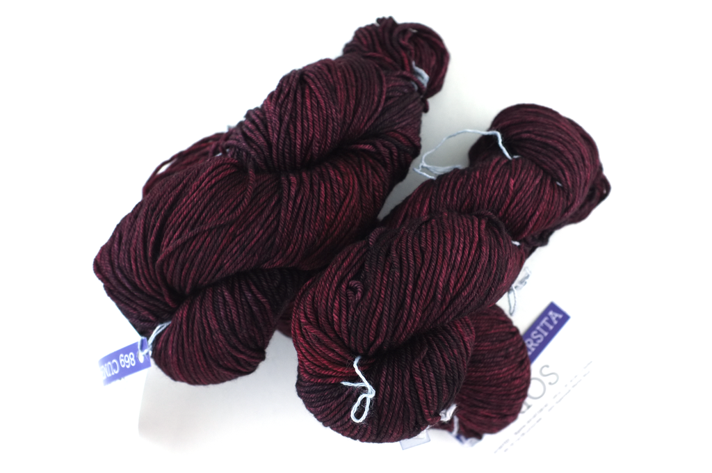 Malabrigo Rios in color Cumparsita, merino wool worsted weight knitting yarn, dark reds, #869