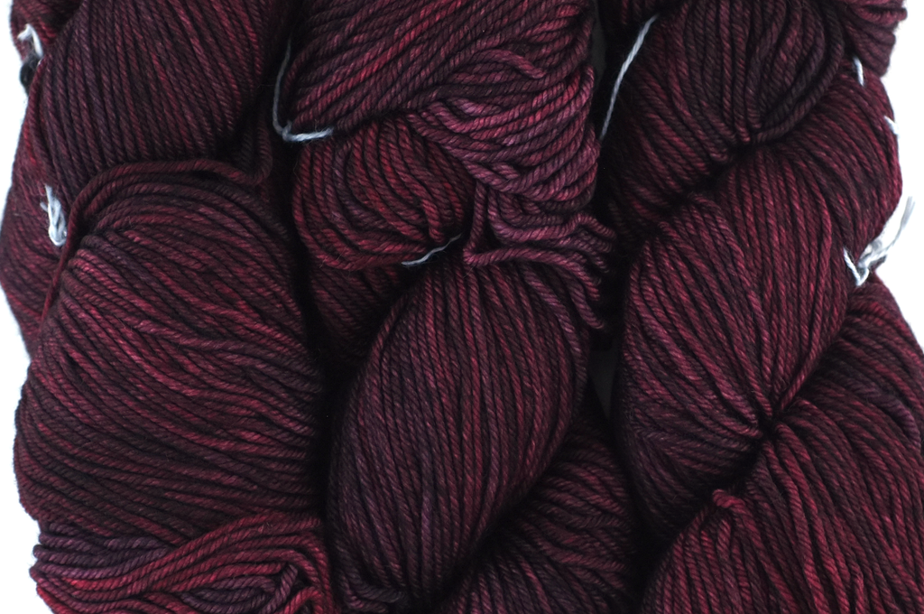 Malabrigo Rios in color Cumparsita, merino wool worsted weight knitting yarn, dark reds, #869