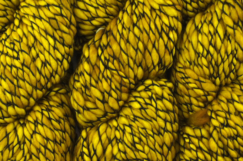 Malabrigo Caracol in color Frank Ochre, #035, Super Bulky thick and thin superwash merino knitting yarn in rich ochre yellow - Purple Sage Yarns