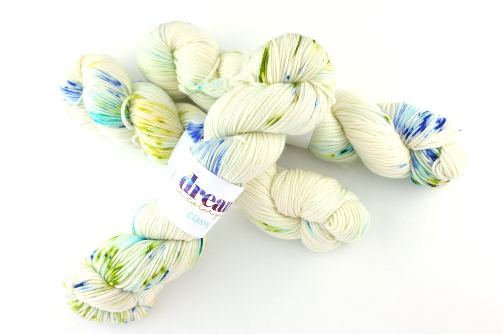 Dream in Color Classy color Fable 529, worsted weight superwash wool knitting yarn, greens on cream